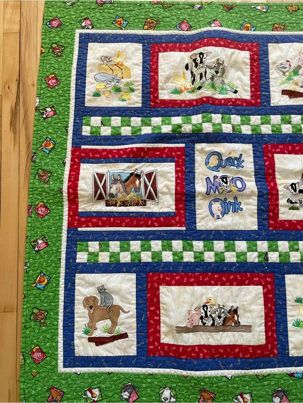 Quack, Moo, Oink quilt with farm animals and 'Quack, Moo, Oink'